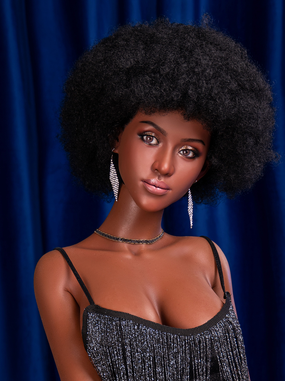 Celia close with the afro spreading wide past her shoulders and silver drops at her ears